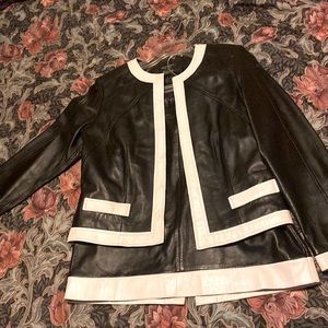 Size 10 black and white suit made by Clothes by Revue.